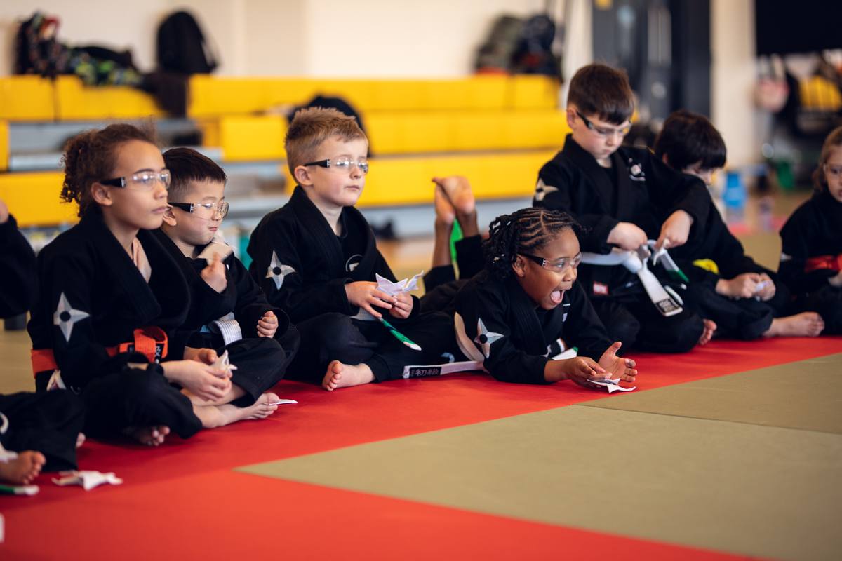Students in safety glasses lining up their shuriken throws